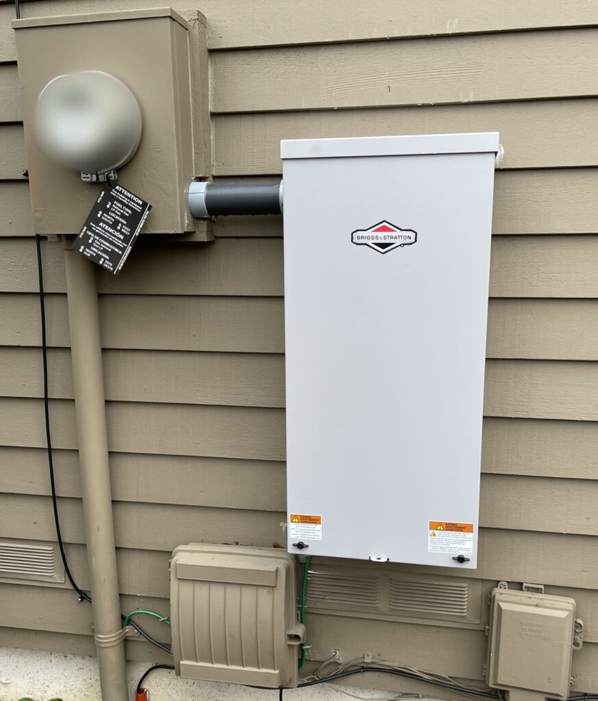 Briggs & Stratton automatic transfer switch mounted next to the meter base
