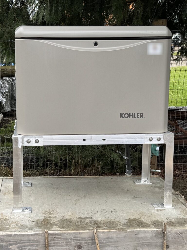 Kohler home standby generator mounted on an aluminum stand