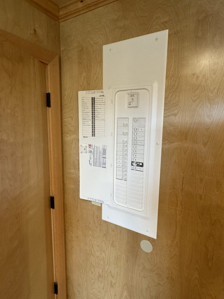New Leviton breaker panel with the door open showing labeled breakers